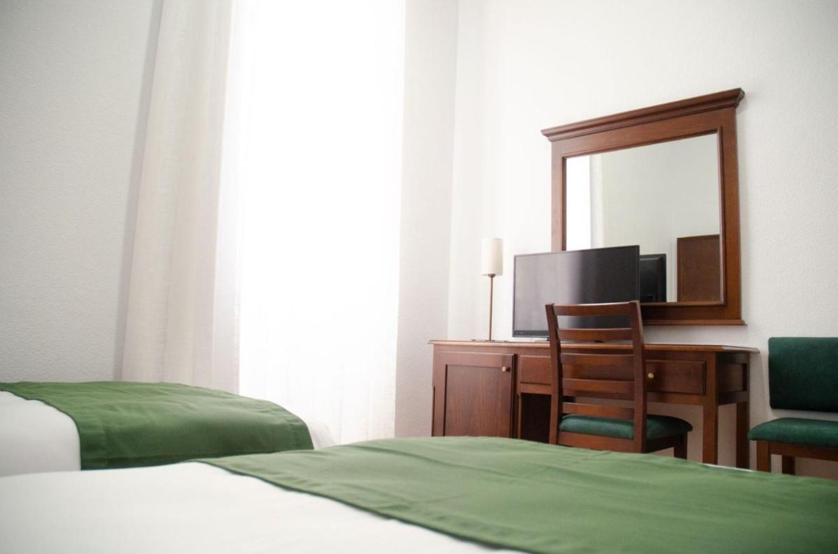Cama o camas de una habitación en Hotel Balneario de Marmolejo