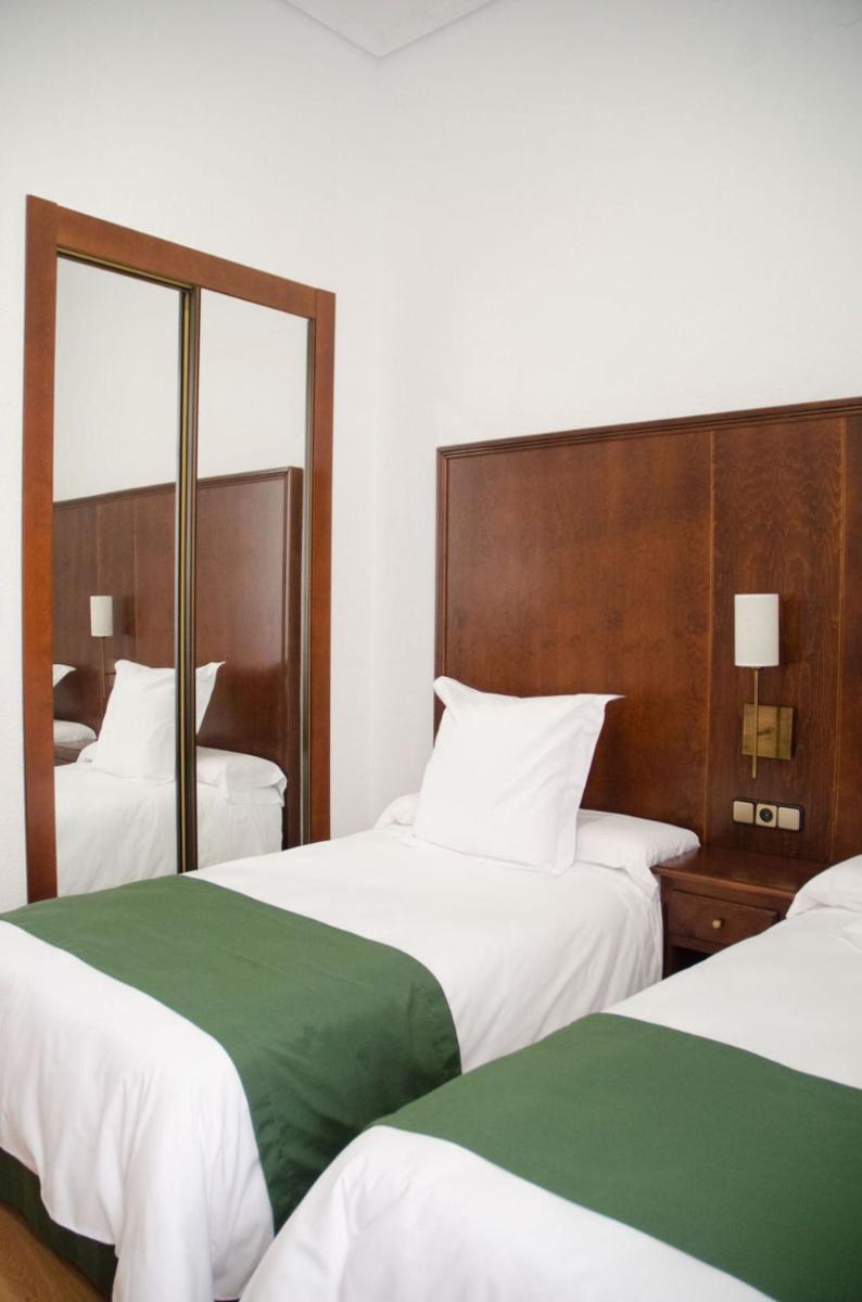 Cama o camas de una habitación en Hotel Balneario de Marmolejo