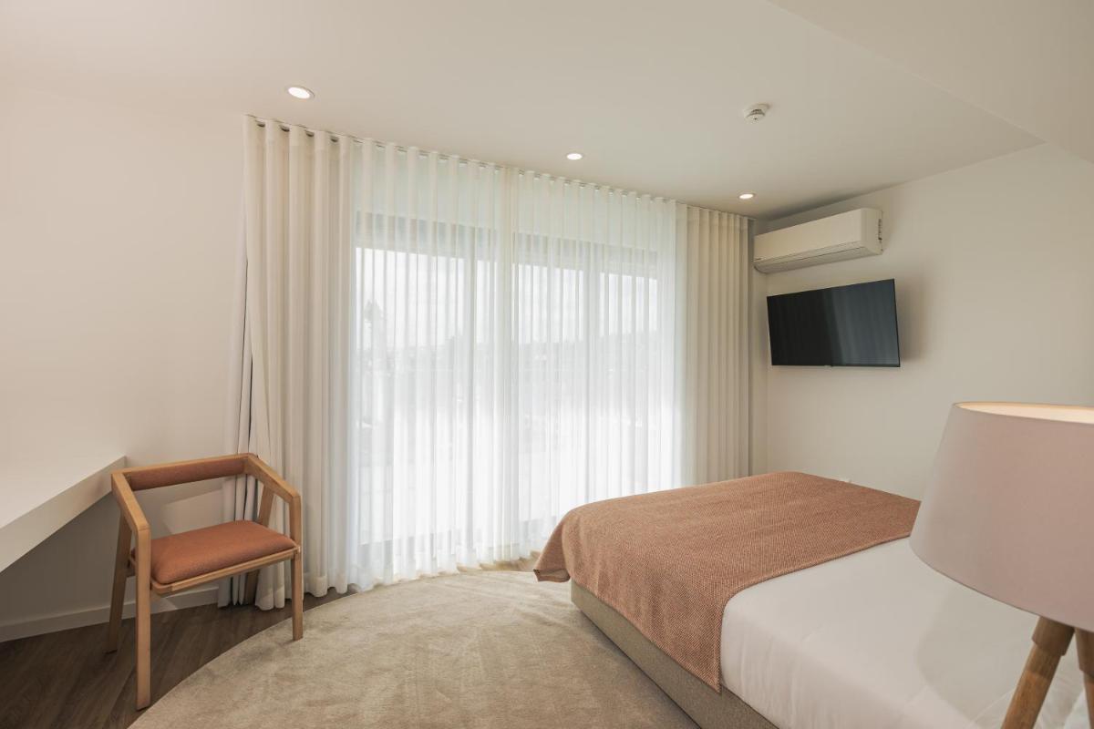 Uma cama ou camas num quarto em Alto do Forte
