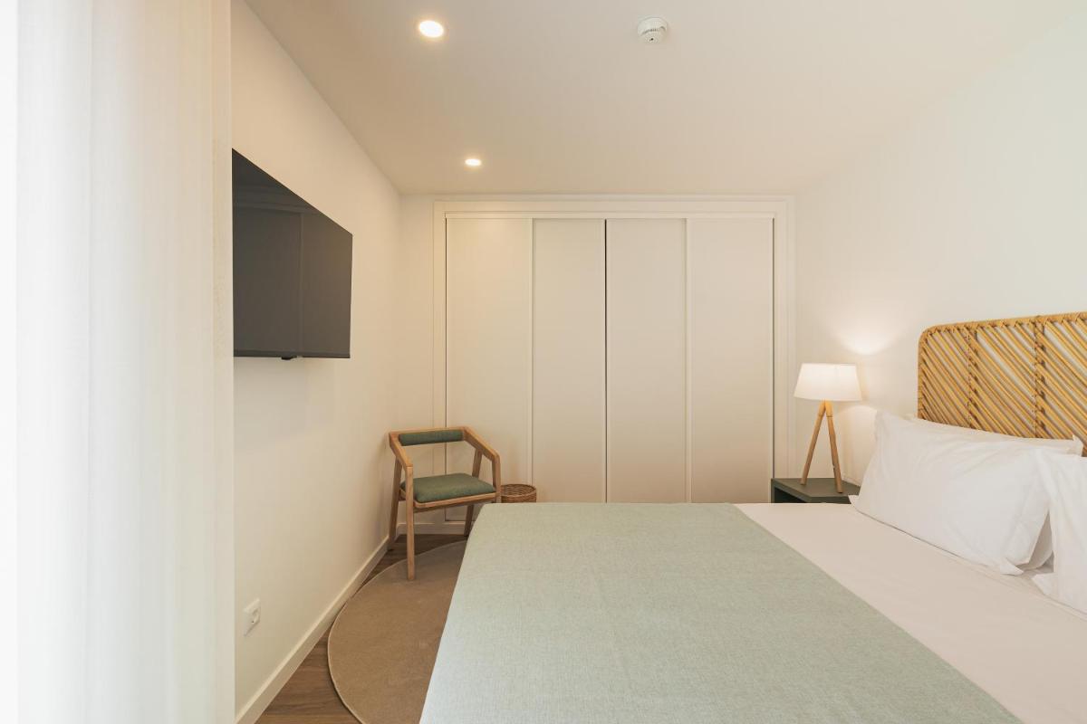 Uma cama ou camas num quarto em Alto do Forte
