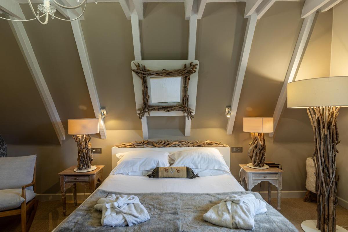 Un ou plusieurs lits dans un hébergement de l'établissement Le Bailliage Hôtel & Spa