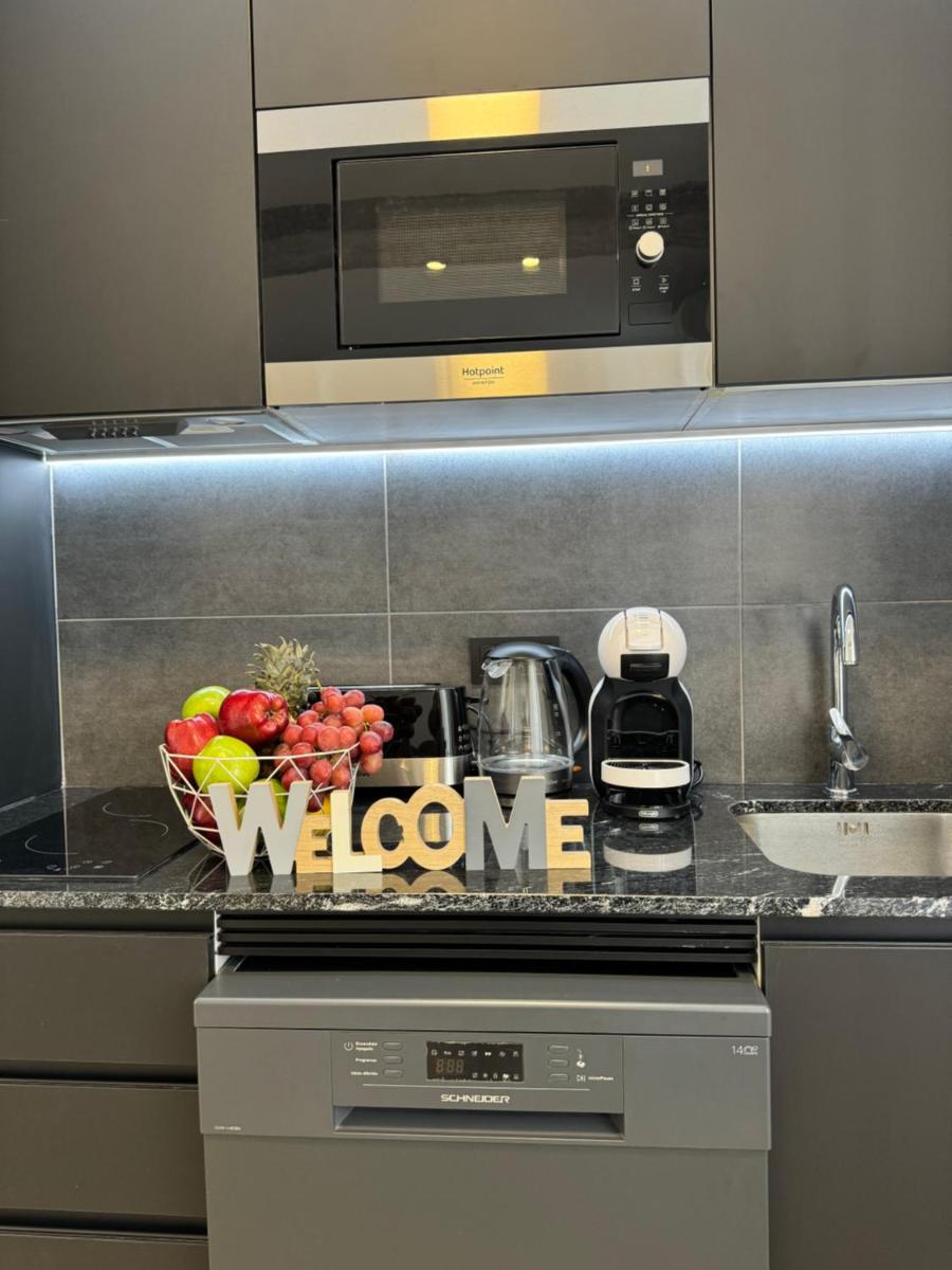 Una cocina o zona de cocina en Apart-hotel Happy Life
