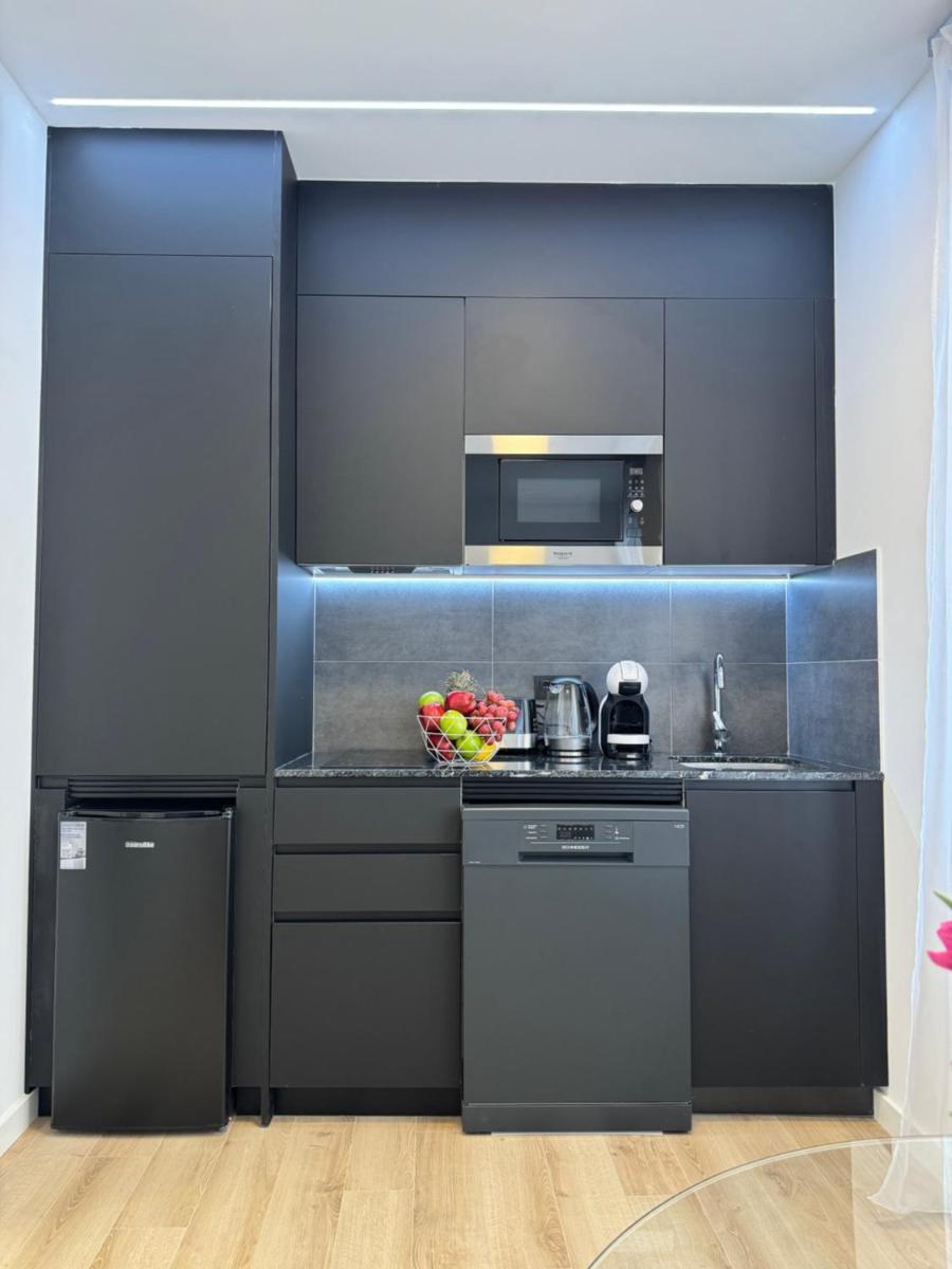 Una cocina o zona de cocina en Apart-hotel Happy Life