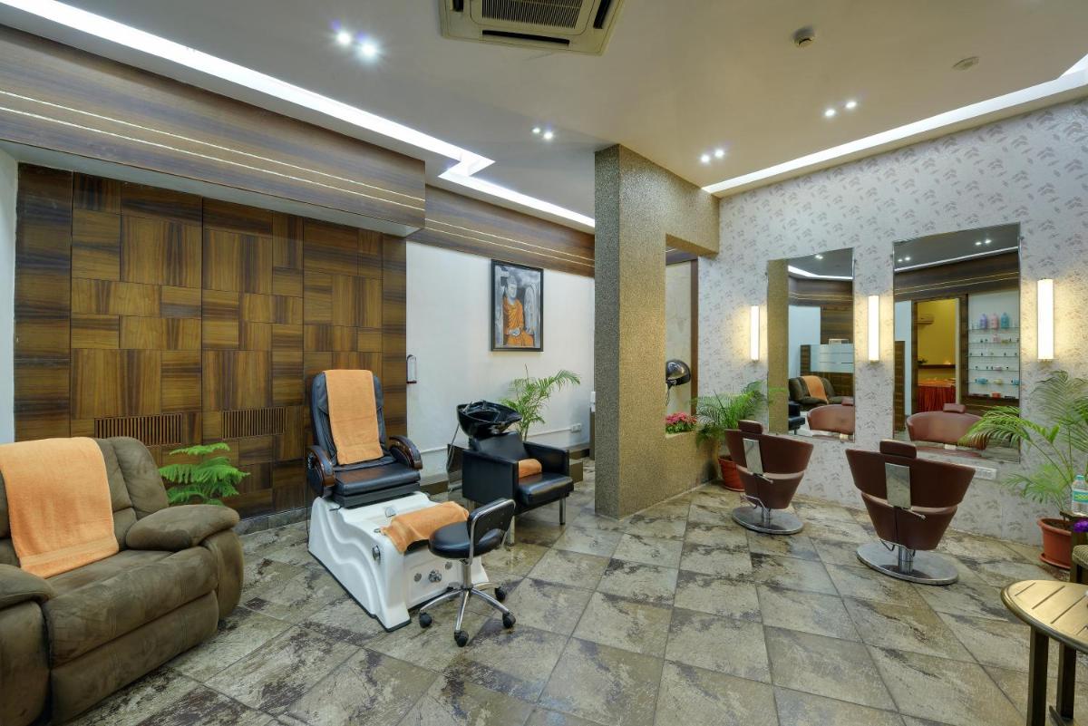 a salon with chairs and a waiting room at The Crown Goa in Panaji