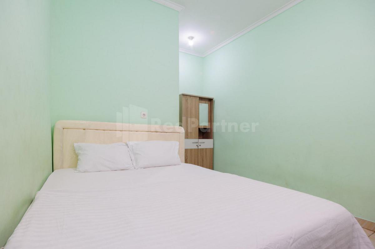 Suitetrails - Fajar Inn Mitra RedDoorz