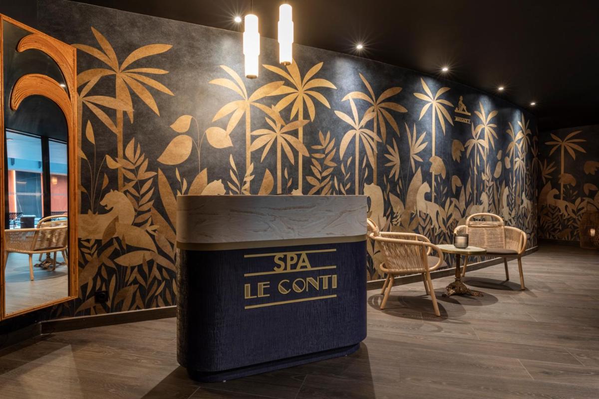Coin salon dans l'établissement Hôtel & Spa Oceania Le Conti