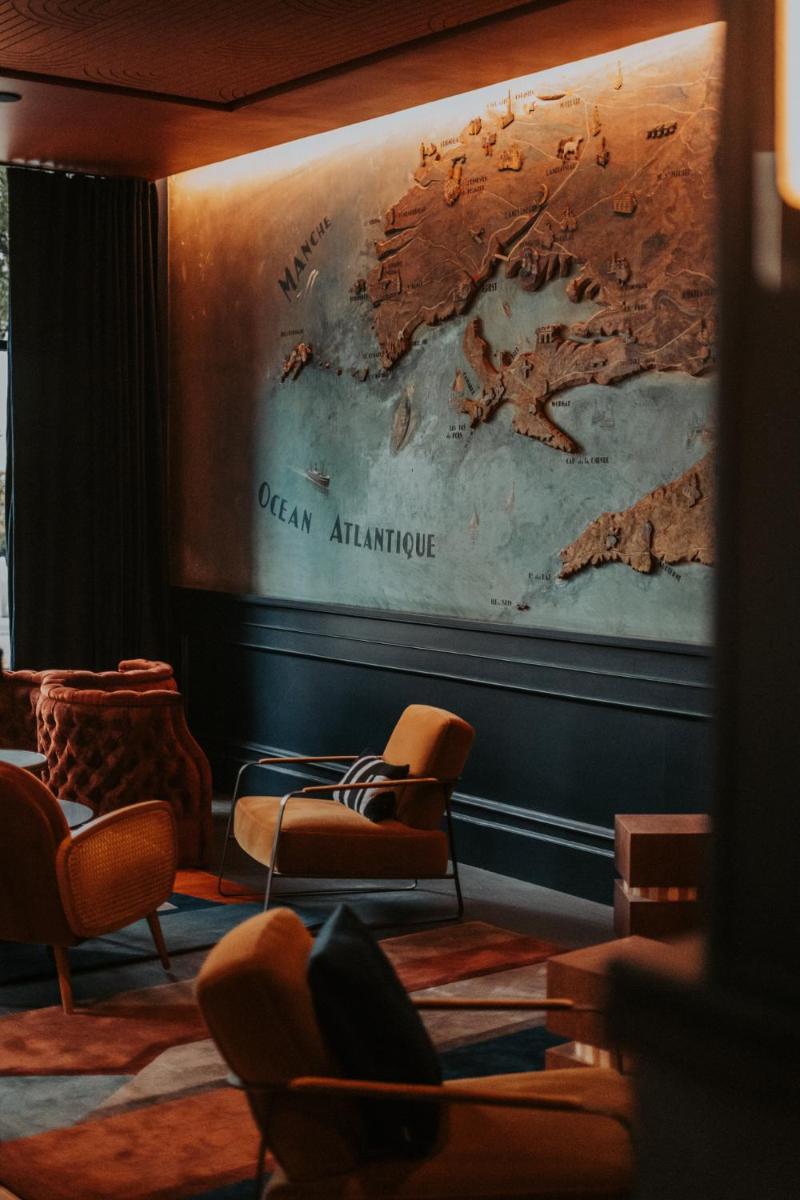 Coin salon dans l'établissement Hôtel & Spa Oceania Le Conti