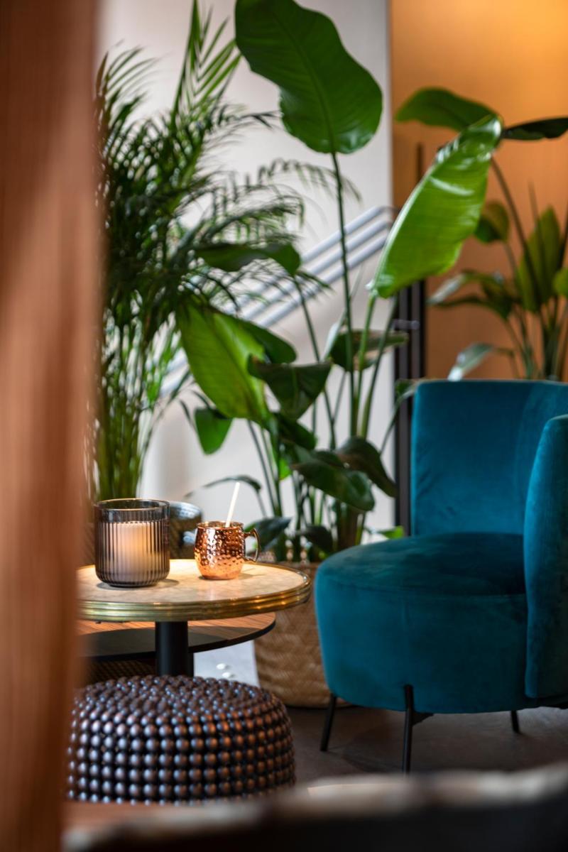 Coin salon dans l'établissement Hôtel & Spa Oceania Le Conti
