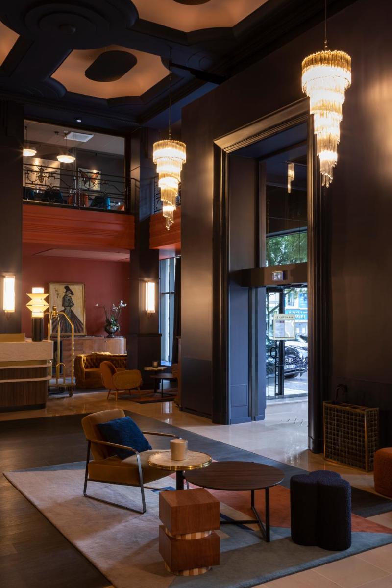 Coin salon dans l'établissement Hôtel & Spa Oceania Le Conti