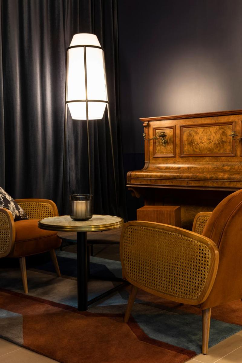 Coin salon dans l'établissement Hôtel & Spa Oceania Le Conti