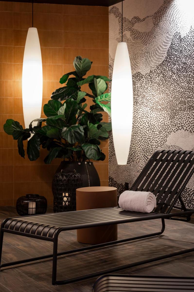 Coin salon dans l'établissement Hôtel & Spa Oceania Le Conti