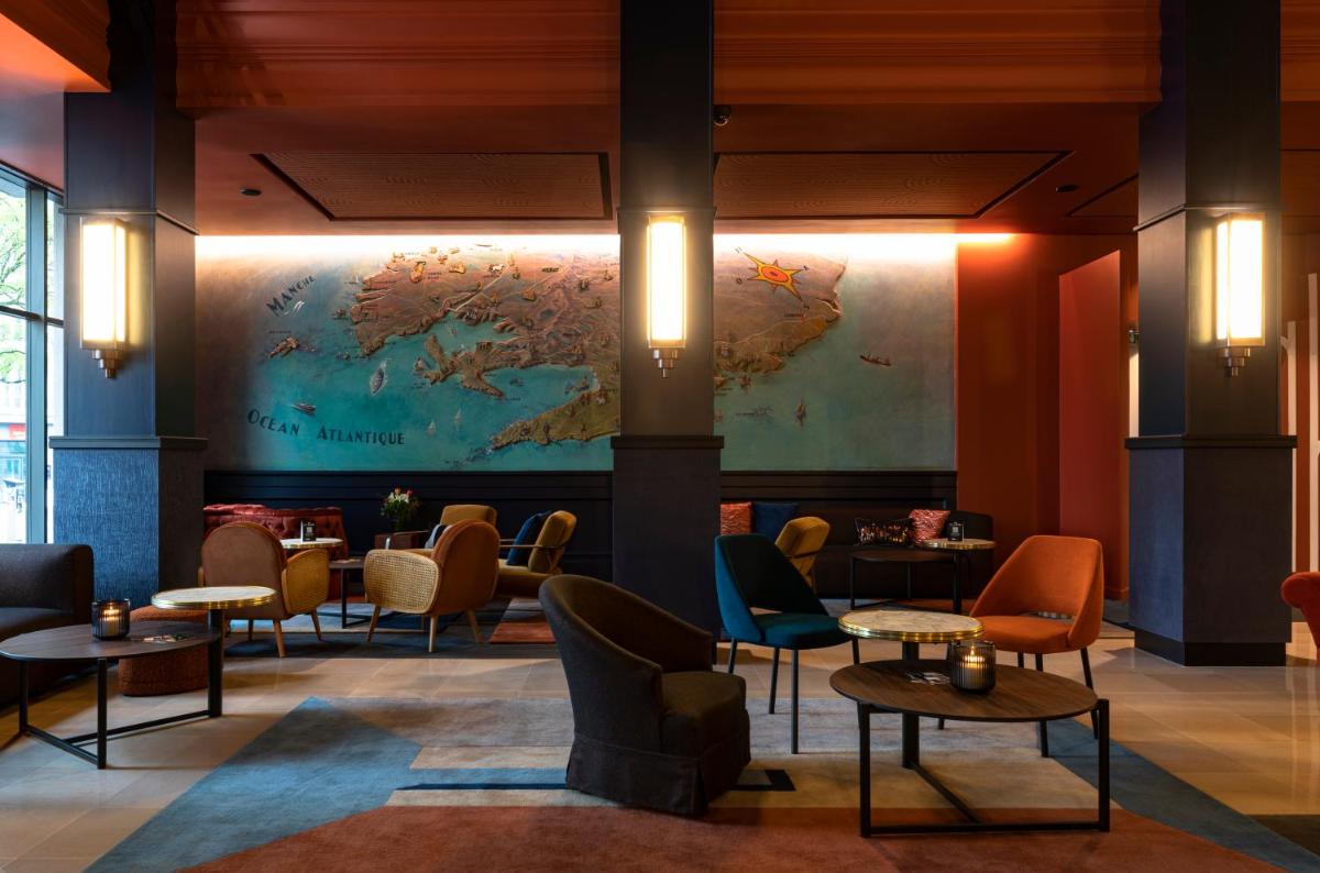 Coin salon dans l'établissement Hôtel & Spa Oceania Le Conti