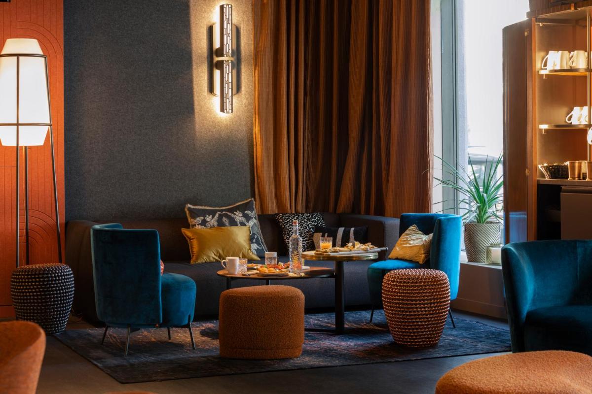 Coin salon dans l'établissement Hôtel & Spa Oceania Le Conti