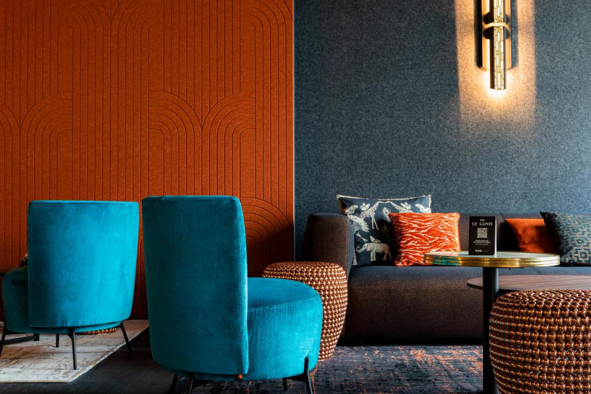 Coin salon dans l'établissement Hôtel & Spa Oceania Le Conti