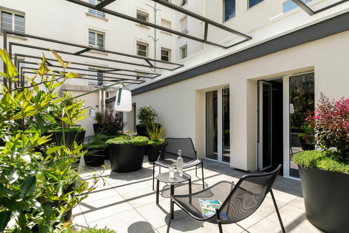 Jardin de l'établissement Hôtel & Spa Oceania Le Conti