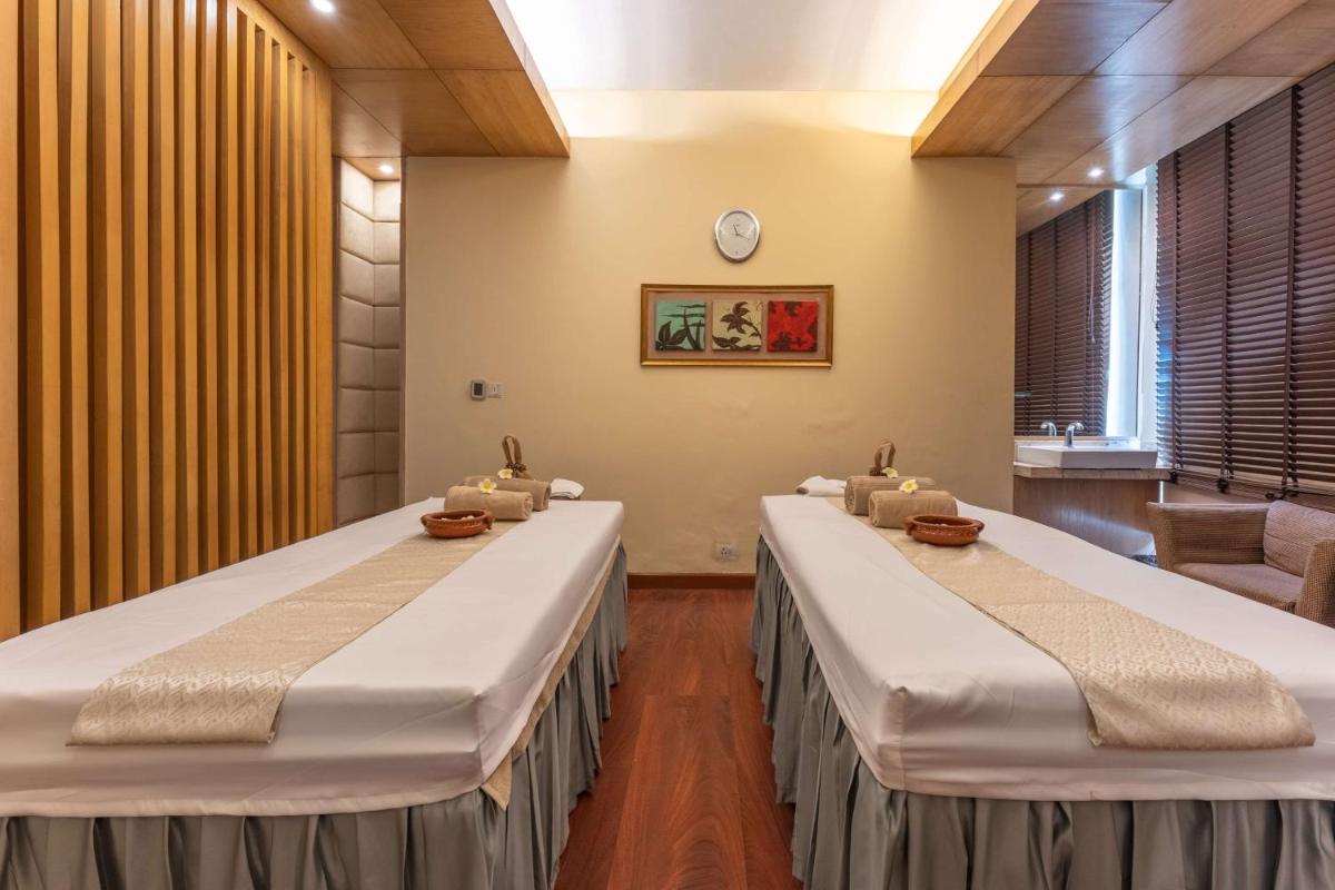a hospital room with two beds in a room at Radisson Blu Hotel, Indore in Indore