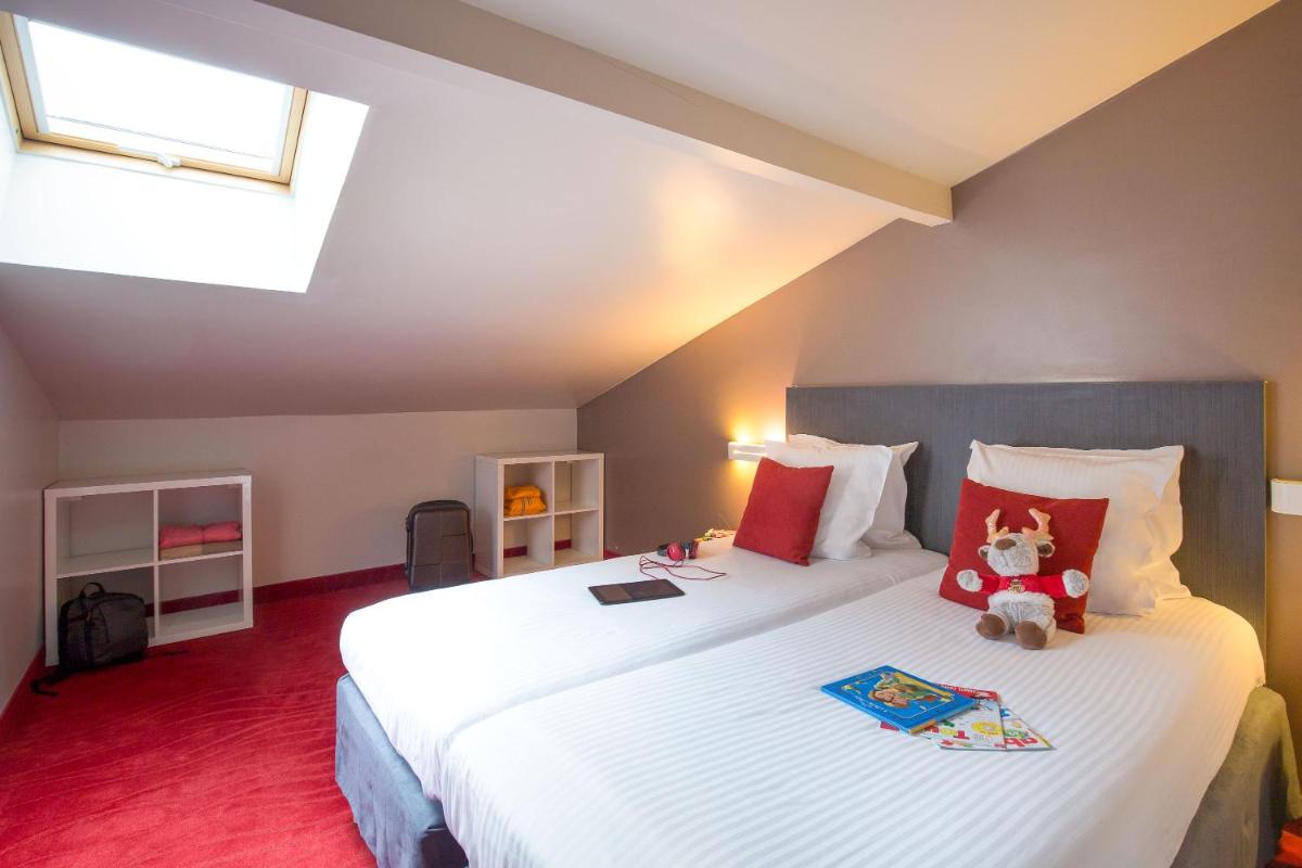 Un ou plusieurs lits dans un hébergement de l'établissement SOWELL HOTELS Le Parc & Spa