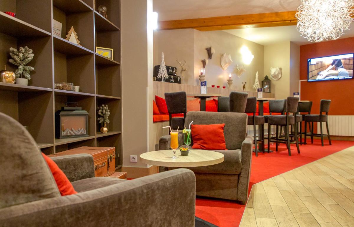 Coin salon dans l'établissement SOWELL HOTELS Le Parc & Spa