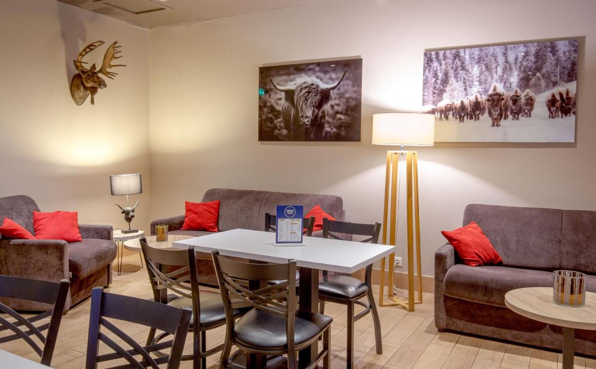 Coin salon dans l'établissement SOWELL HOTELS Le Parc & Spa