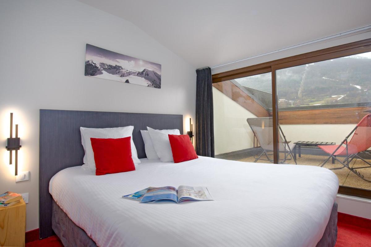 Un ou plusieurs lits dans un hébergement de l'établissement SOWELL HOTELS Le Parc & Spa
