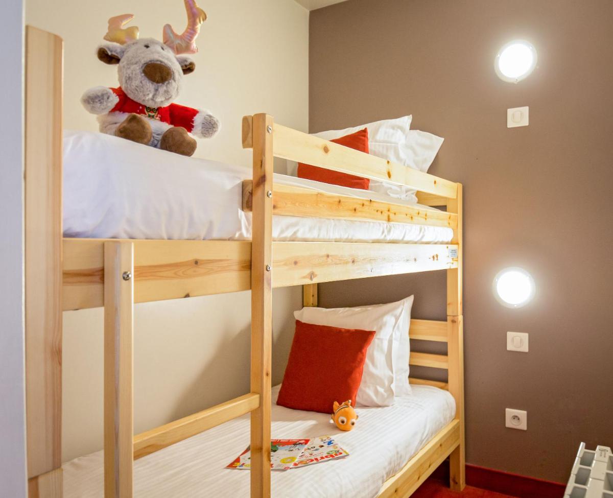 Un ou plusieurs lits dans un hébergement de l'établissement SOWELL HOTELS Le Parc & Spa