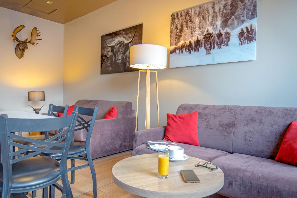 Coin salon dans l'établissement SOWELL HOTELS Le Parc & Spa