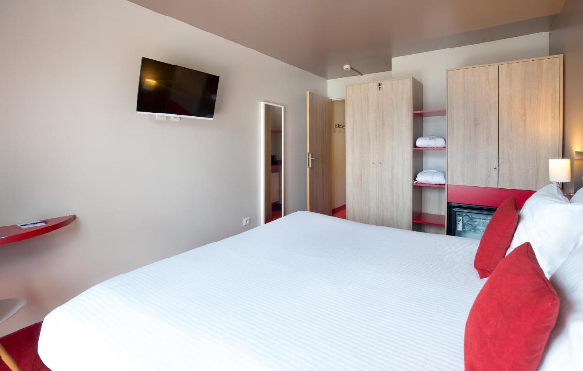 Un ou plusieurs lits dans un hébergement de l'établissement SOWELL HOTELS Le Parc & Spa