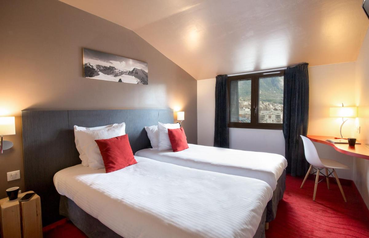 Un ou plusieurs lits dans un hébergement de l'établissement SOWELL HOTELS Le Parc & Spa