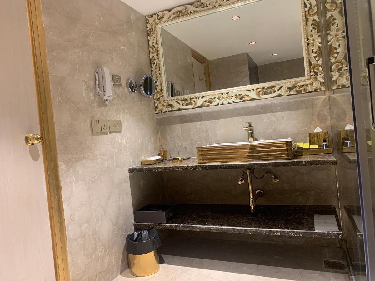 a bathroom with a sink and a mirror at The Accord Metropolitan in Chennai