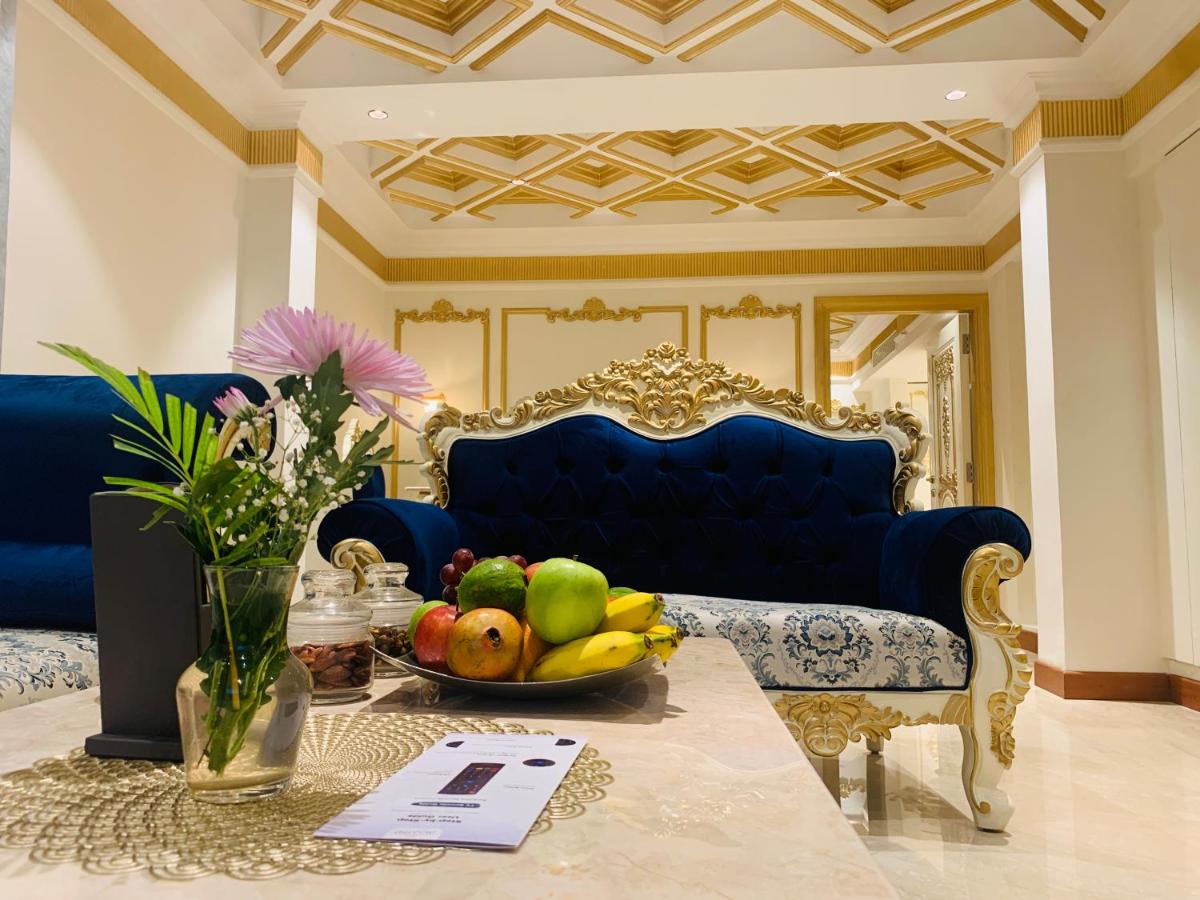 a living room with a bowl of fruit on a table at The Accord Metropolitan in Chennai