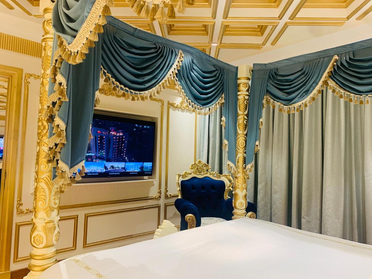 a bedroom with a bed and a tv and curtains at The Accord Metropolitan in Chennai