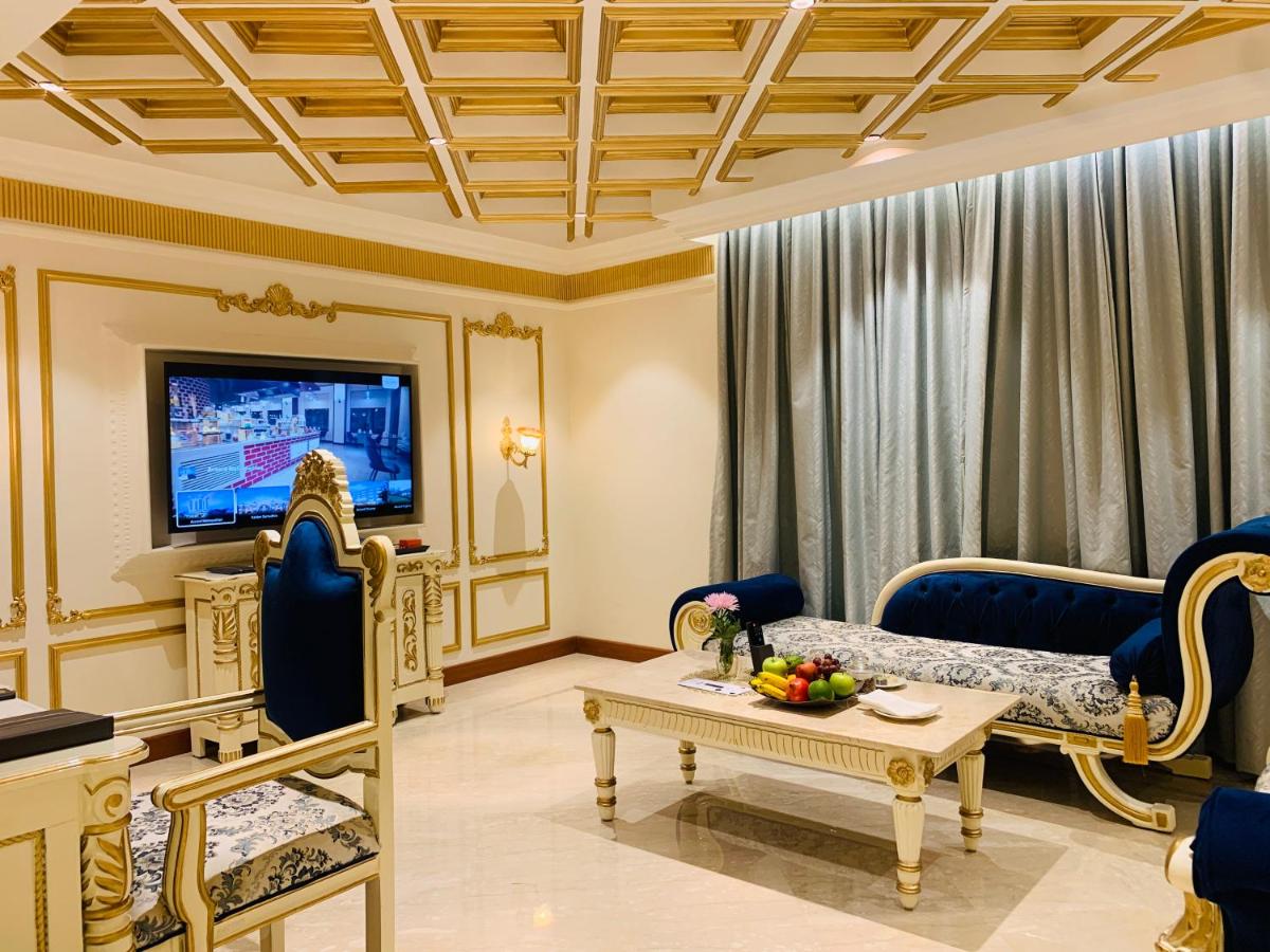 a living room with a couch and a tv at The Accord Metropolitan in Chennai