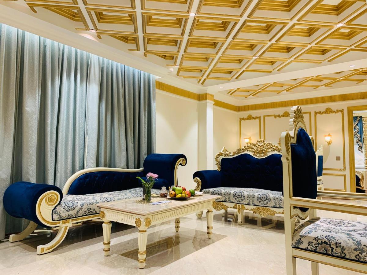 a living room with blue couches and a table at The Accord Metropolitan in Chennai