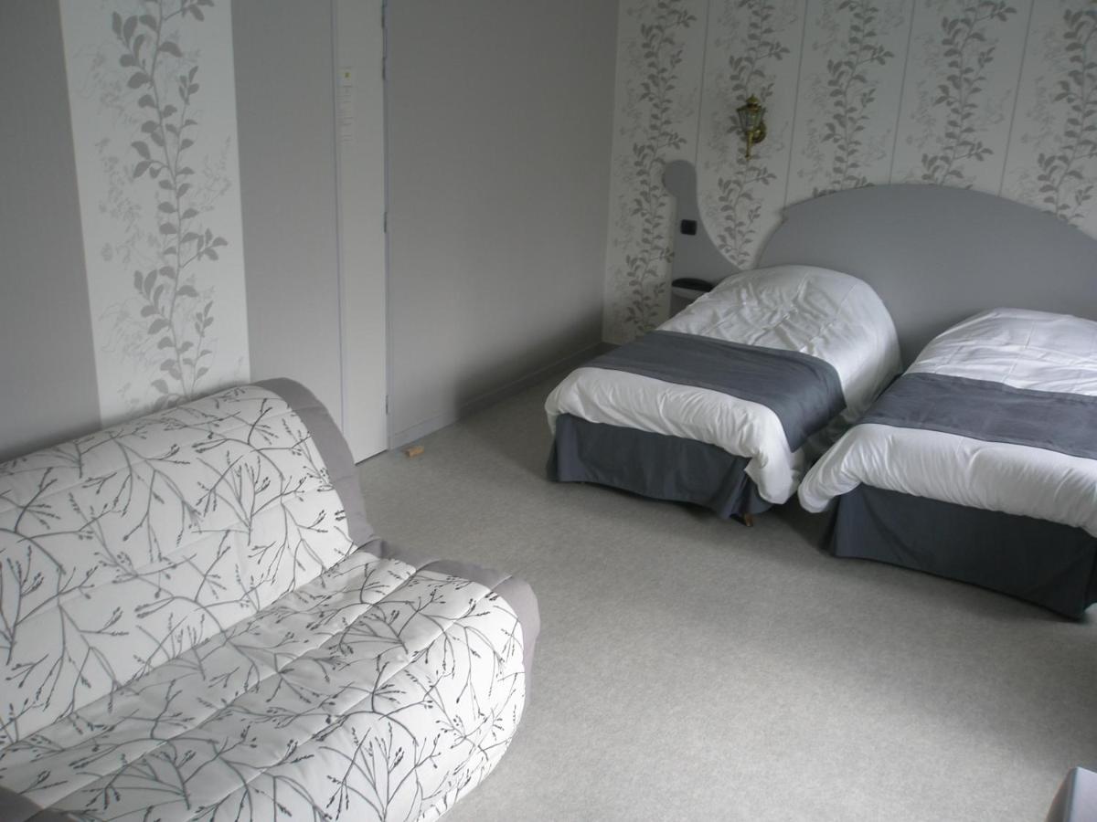 Un ou plusieurs lits dans un hébergement de l'établissement Logis SPA Hotel Restaurant De La Poste