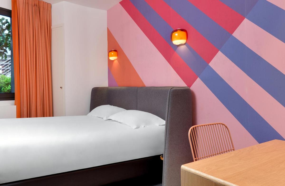 Un ou plusieurs lits dans un hébergement de l'établissement Hôtel De L'octroi
