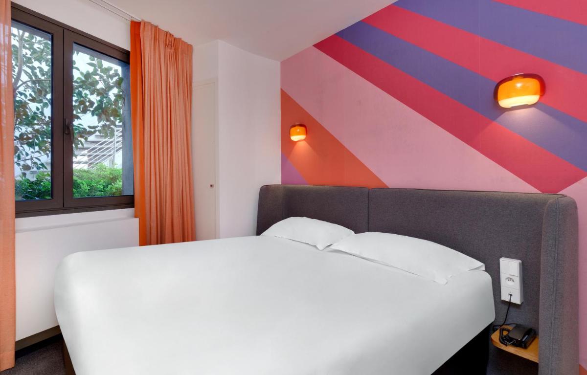 Un ou plusieurs lits dans un hébergement de l'établissement Hôtel De L'octroi