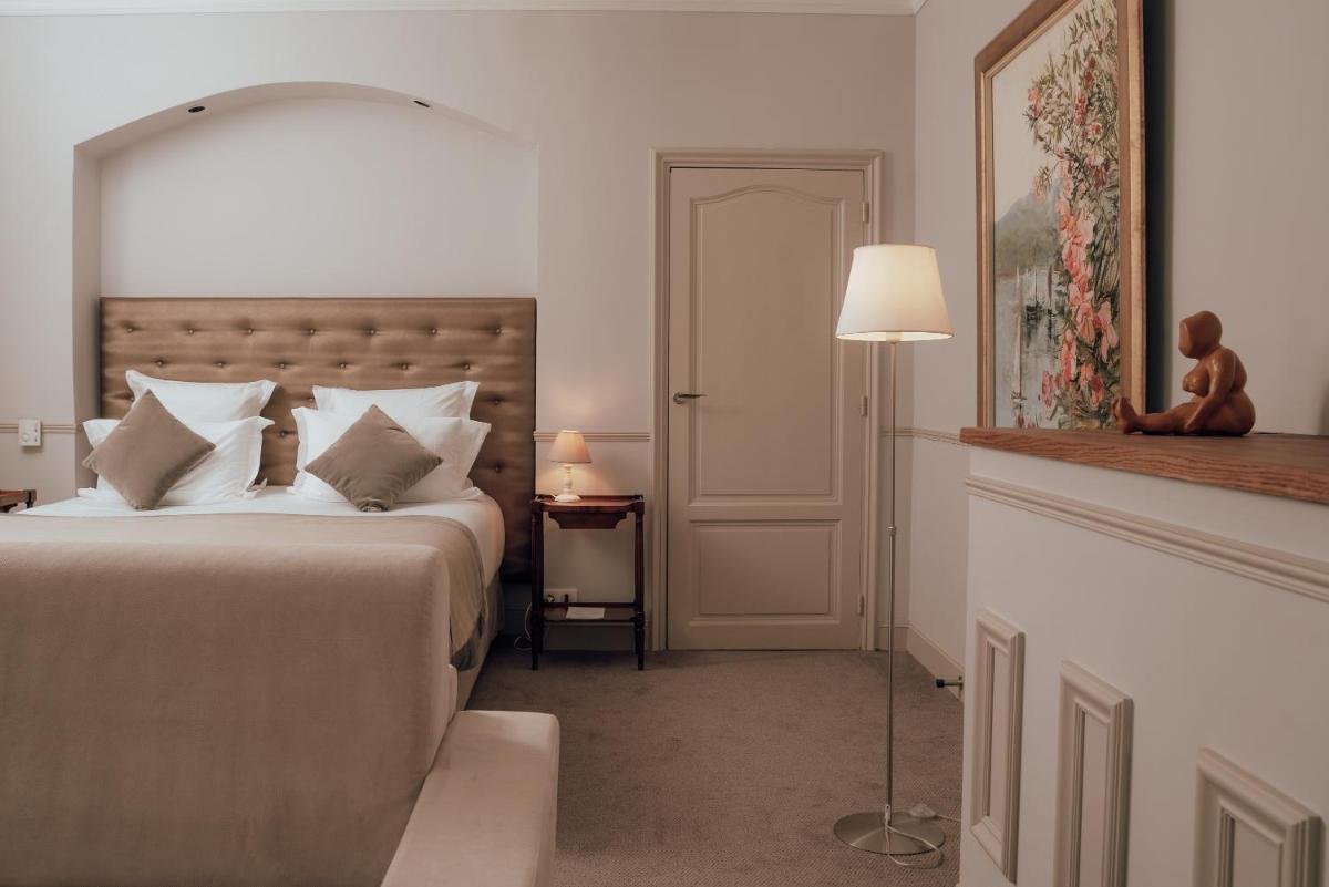Un ou plusieurs lits dans un hébergement de l'établissement Ermitage de l'Oasis & Spa - Cannes Mandelieu