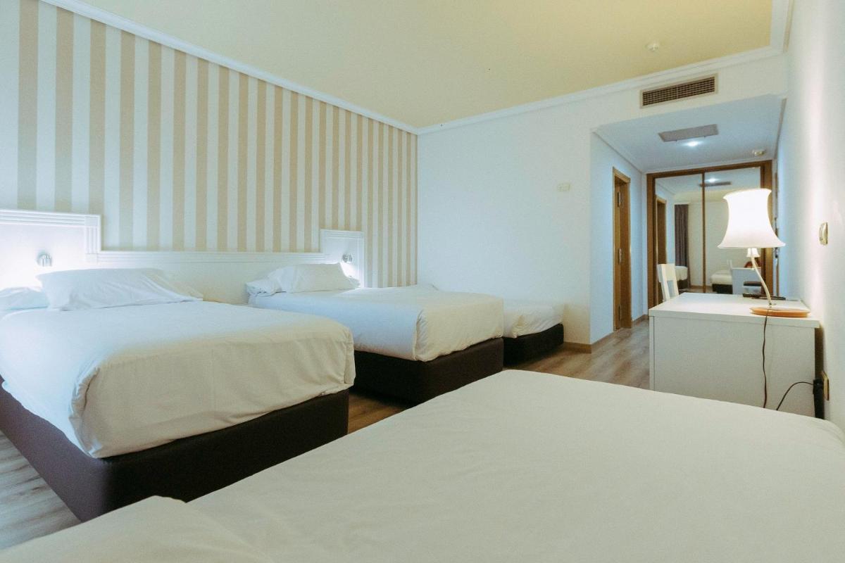 Cama o camas de una habitación en Hotel Alfonso I