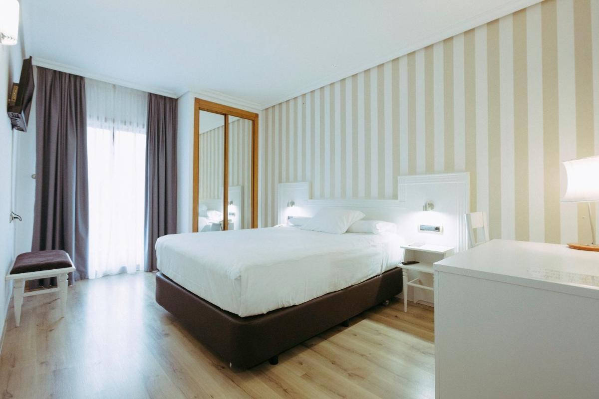 Cama o camas de una habitación en Hotel Alfonso I