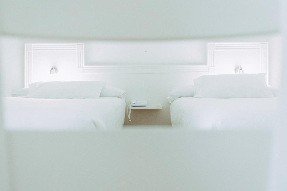 Cama o camas de una habitación en Hotel Alfonso I