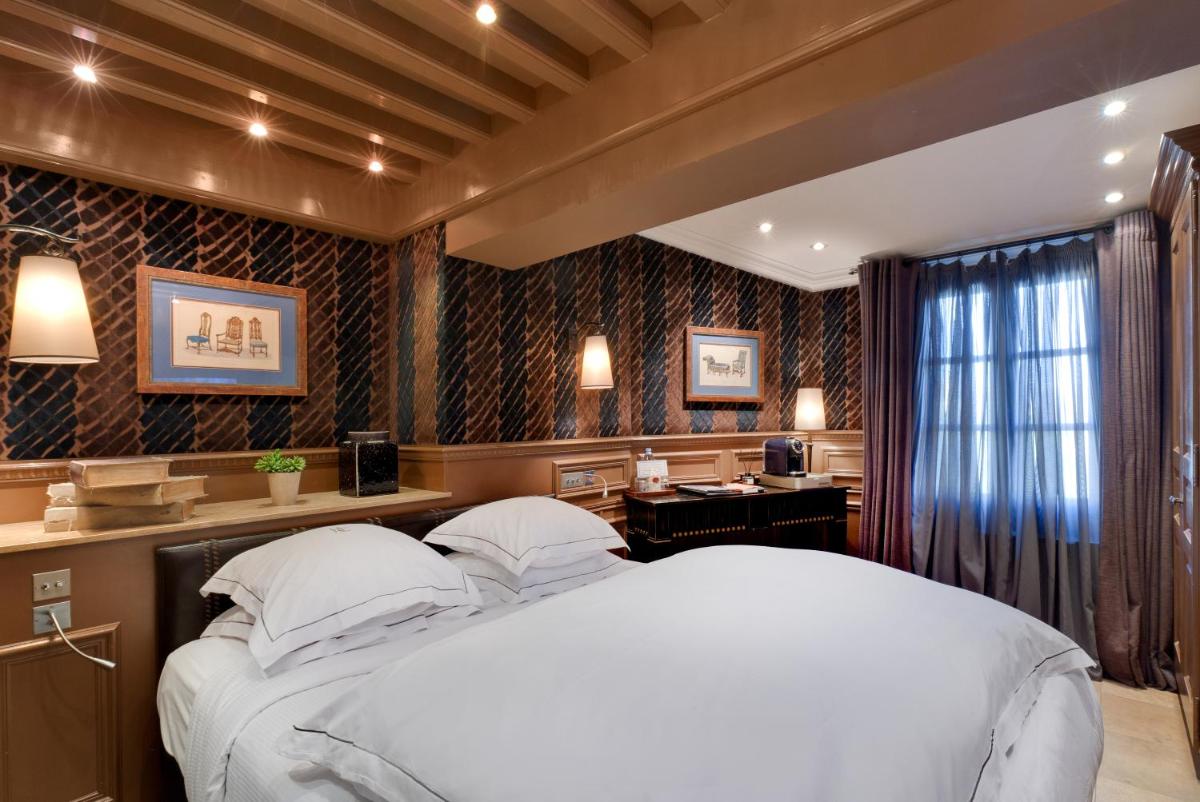 Un ou plusieurs lits dans un hébergement de l'établissement Hôtel du Château & Spa - Teritoria