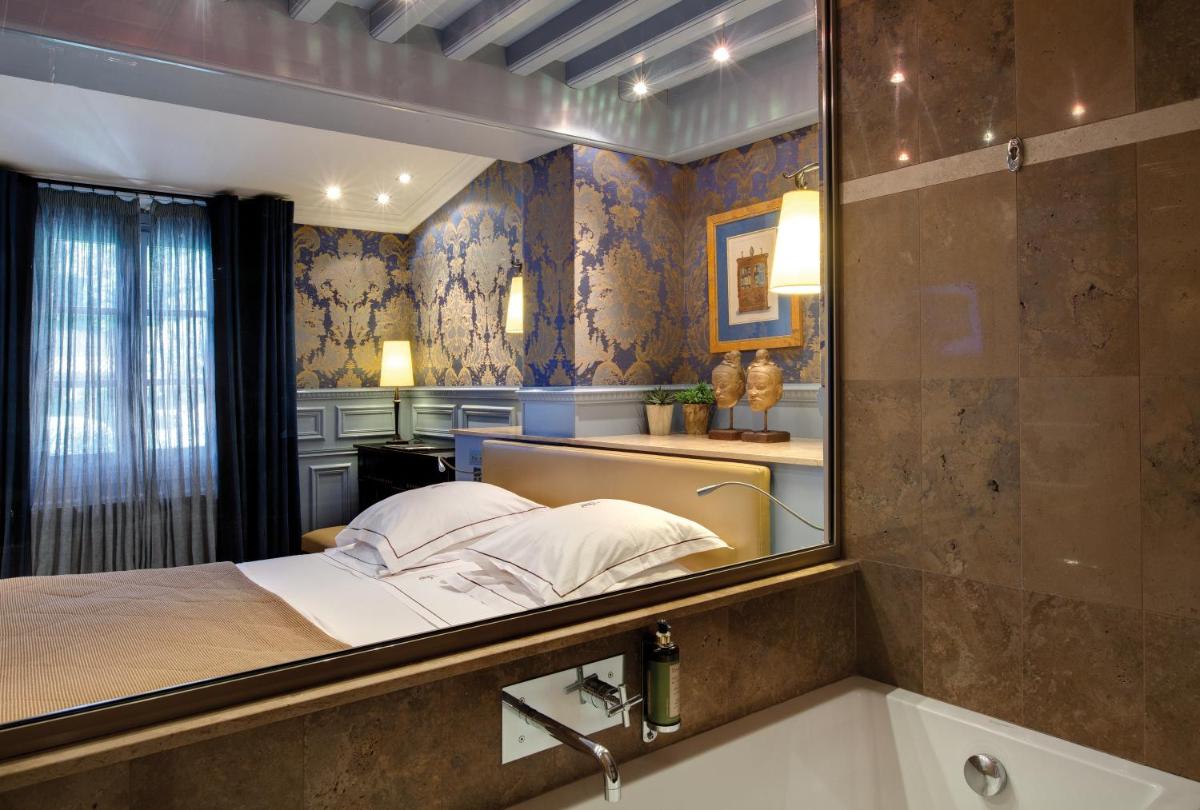 Un ou plusieurs lits dans un hébergement de l'établissement Hôtel du Château & Spa - Teritoria