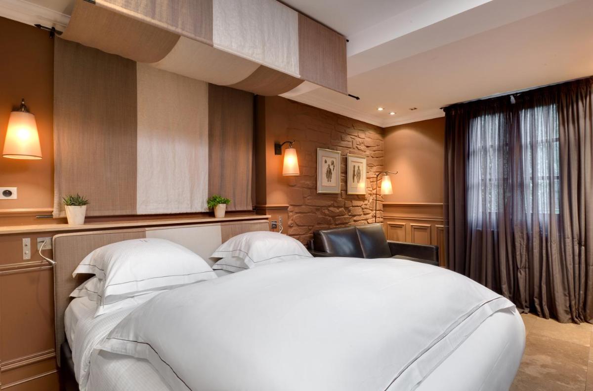 Un ou plusieurs lits dans un hébergement de l'établissement Hôtel du Château & Spa - Teritoria