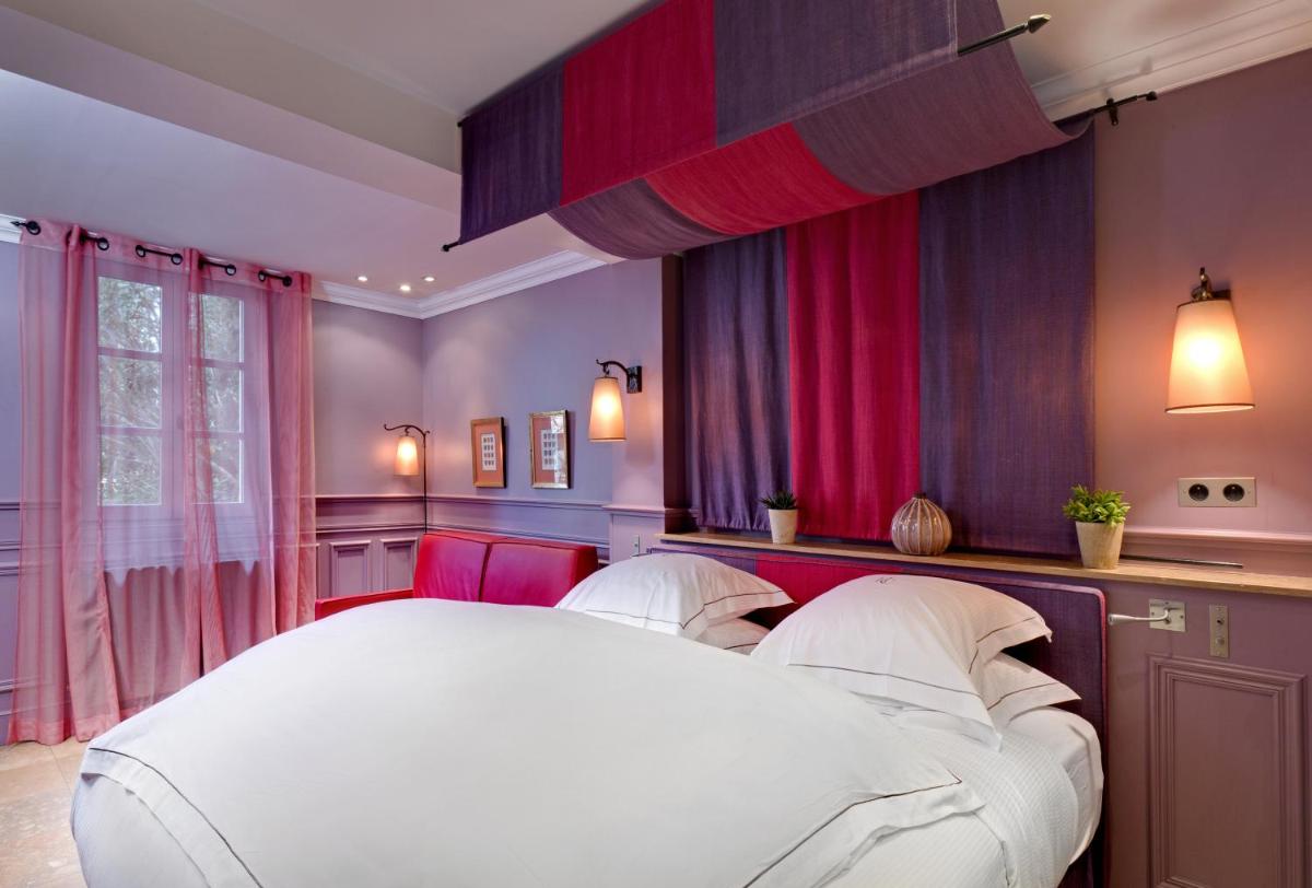 Un ou plusieurs lits dans un hébergement de l'établissement Hôtel du Château & Spa - Teritoria