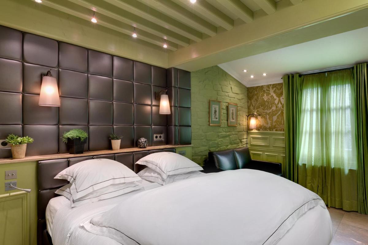 Un ou plusieurs lits dans un hébergement de l'établissement Hôtel du Château & Spa - Teritoria