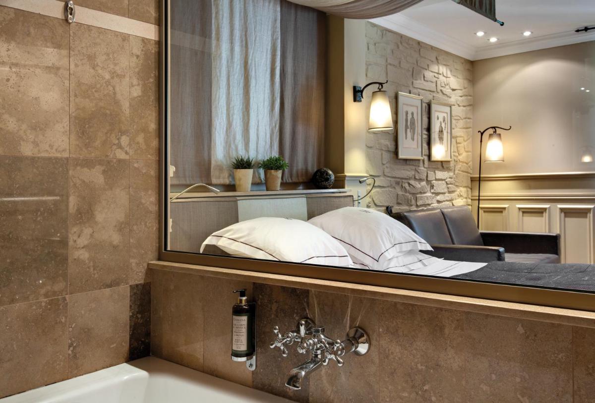 Un ou plusieurs lits dans un hébergement de l'établissement Hôtel du Château & Spa - Teritoria