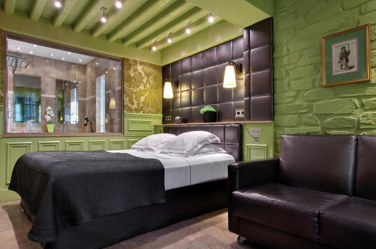 Un ou plusieurs lits dans un hébergement de l'établissement Hôtel du Château & Spa - Teritoria
