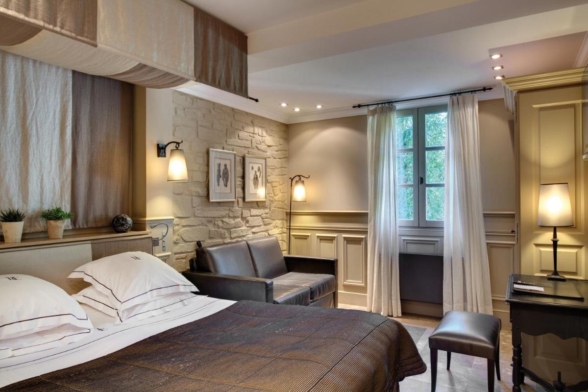 Un ou plusieurs lits dans un hébergement de l'établissement Hôtel du Château & Spa - Teritoria