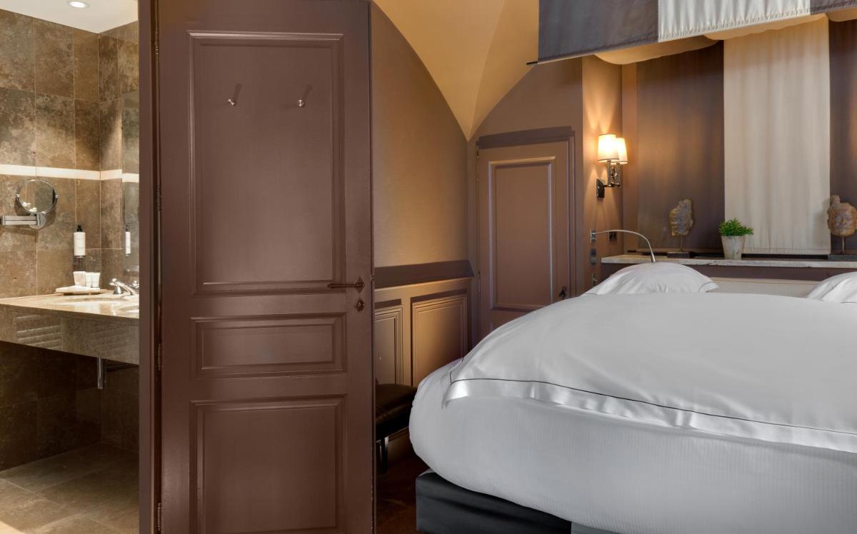 Un ou plusieurs lits dans un hébergement de l'établissement Hôtel du Château & Spa - Teritoria