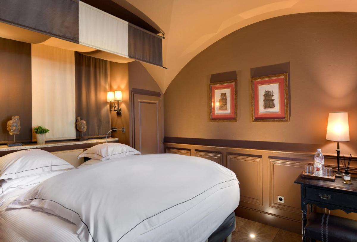 Un ou plusieurs lits dans un hébergement de l'établissement Hôtel du Château & Spa - Teritoria